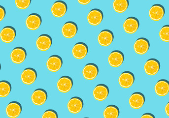 Summer and vitamins background. Lemon on a blue background, minimal food concept