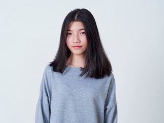 Fototapeta premium Smiling young woman over white background