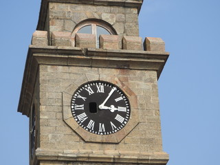 Fototapeta na wymiar City clock tower in the town of Galle in Sri Lanka. Galle - the largest city and port in the south of Sri Lanka, the capital of the southern province and a popular tourist destination