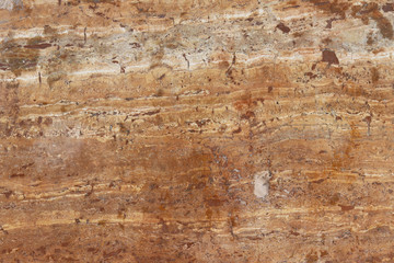 The plate is made of brown marble with a color streaks. brownish-white shades. Smooth texture for design and decoration. Natural building material. Natural patterns on the stone. Plates for floor