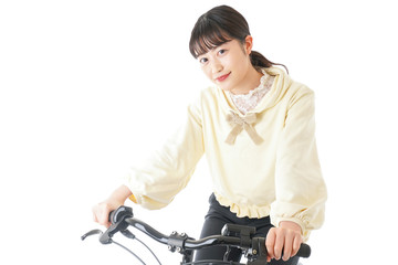 Fototapeta na wymiar 自転車に乗る若い女性