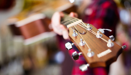 close-up of wooden fretboard of guitar