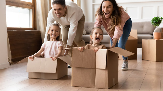 Overjoyed family have fun on moving day