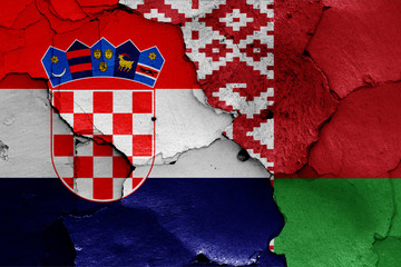 flags of Croatia and Belarus painted on cracked wall