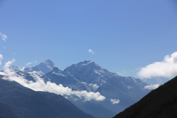 Fototapeta na wymiar Snowy mountains against the blue sky. Mountains of Nepal