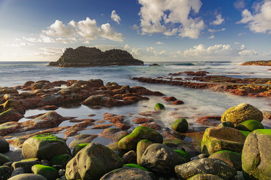 El Pris volcanic rocks with green moss,  Atlantic ocean volcanic seascape, long exposure photography, Tacoronte, Tenerife, Canary islands, Spain