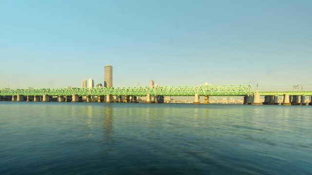 Time lapse of steel bridge for train and metro on the Han River in Seoul, Korea.