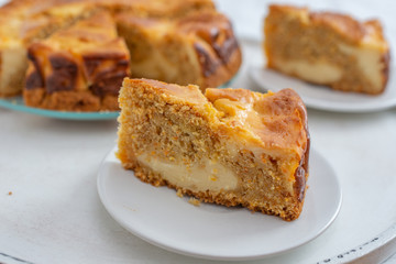 home made carrot cake cheesecake on a table