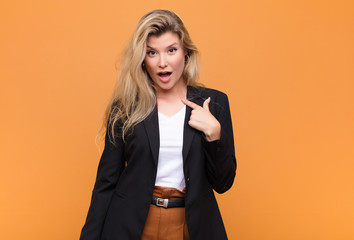  looking shocked and surprised with mouth wide open, pointing to self