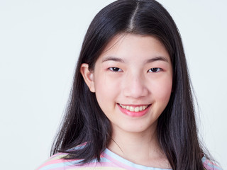 Fototapeta premium Smiling young woman over white background