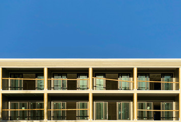 Apartment Building Construction With Unfinished Balcony Set Against Blue Sky
