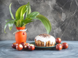 Easter. Traditional Easter cakes with painted eggs in an onion peel and a green bouquet of fresh leaves. We celebrate the holiday.