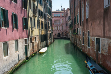 Venice. View of Venice Streets, canals, bridges, gondolas. Biennale. Colorful Old Authentic Buildings in Venice: doors, windows. Architecture of Ancient Italian city. Travel Tourism Concept. 