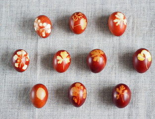 Easter. Traditional onion-peeled eggs on a canvas tablecloth. Arranged in synchronous order. We...