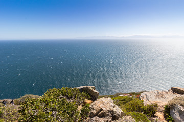 Cliff with vast horizon of the Atlantic Ocean in Southern Africa - calm sea