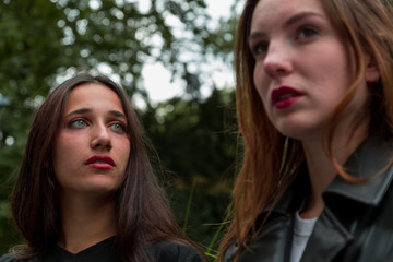 Young women looking away outdoors 