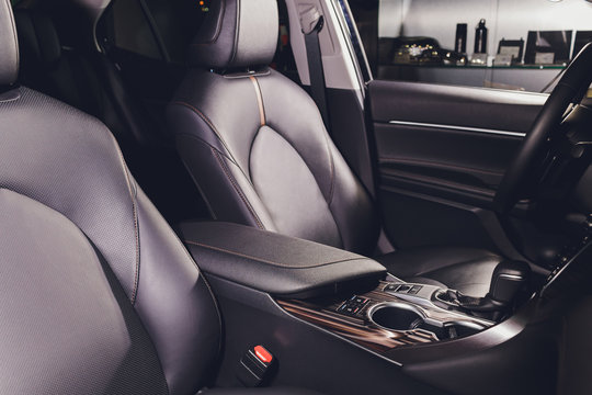 Black leather seat in a car cabin.