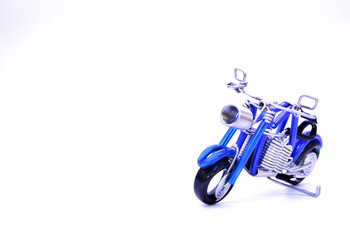 Blue Mini motorcycle made of wire on a white background