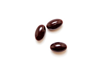 Chocolates in chocolate glaze isolated on white