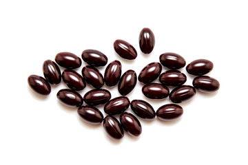 Chocolates in chocolate glaze isolated on white