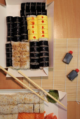 background on the theme of sushi.  different types of sushi on the table
