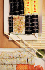 background on the theme of sushi.  different types of sushi on the table