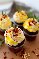 cupcakes with cream and sprinkles