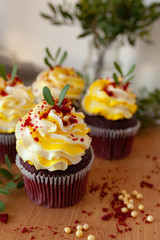 Fototapeta na wymiar cupcakes with cream and sprinkles