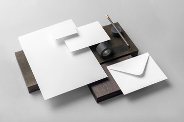 Real photo, stationery branding mockup template, isolated on light grey background with wooden...