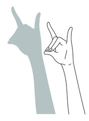 狐の影絵を作る女性の手元