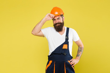 craftsman keep head safe in helmet. building improvement and renovation. brutal male painter ready...
