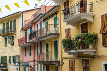 Fototapeta na wymiar Colorful building and facet building in Vernazza fishing village in Cinque Terre National Park, UNESCO world heritage, La Spezia region, Liguria