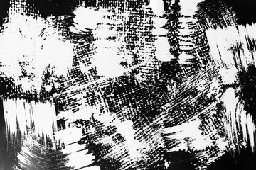 Patterns of white paint from a brush on a black background