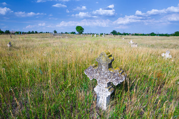 Stone tomb crosses on an ancient Christian necropolis of the 17th-19th centuries. The steppe hills on the right bank of the Dnipro river. Former settlements of Cossacks of Zaporizhzhya Sich in Ukraine