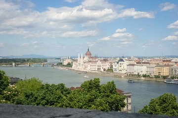 Fototapeta premium Beautiful view of hungarian parliament building along the river Danube in Budapest, Hungary