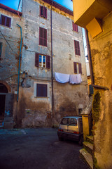 Obraz na płótnie Canvas Beautiful Italian street of a small old provincial town