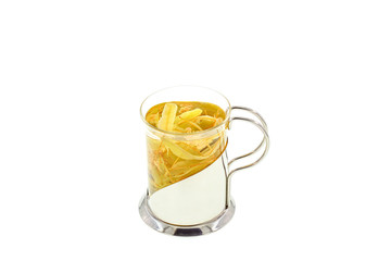 Therapeutic medicinal tincture of dried linden blossom in a mug on a white background