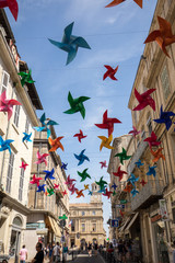  Street decorated with colorful stars in Arles, Provence. France