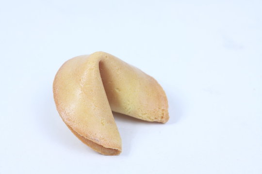 fortune cookie isolated on white background. Image contains copy space