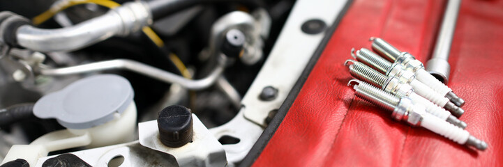 Focus on car details used for perfect auto functionality in modern engineering service station....