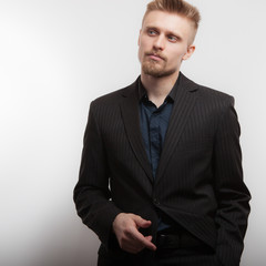 Handsome young elegant man studio portrait.