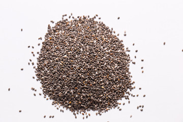 Chia seeds on a white isolated background close-up.
