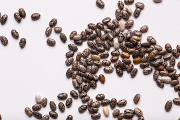 Chia seeds on a white isolated background close-up.