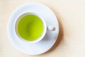 Top view of hot green tea on the table