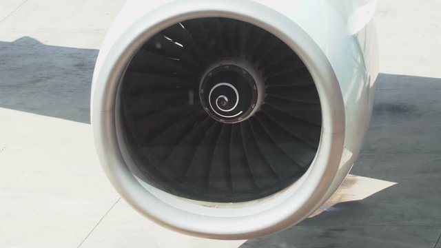 Close-up airplane turbine in working condition before takeoff.Airport.