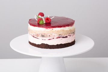close up of conceptual fruit cake on gray background