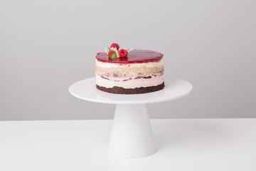 close up of conceptual fruit cake on gray background