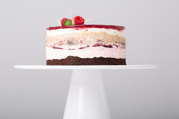 close up of conceptual fruit cake on gray background