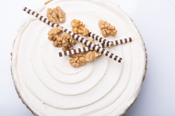 details of tasty conceptual walnut cake, on gray background