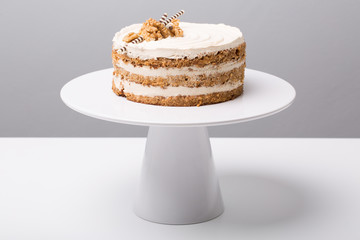 details of tasty conceptual walnut cake, on gray background